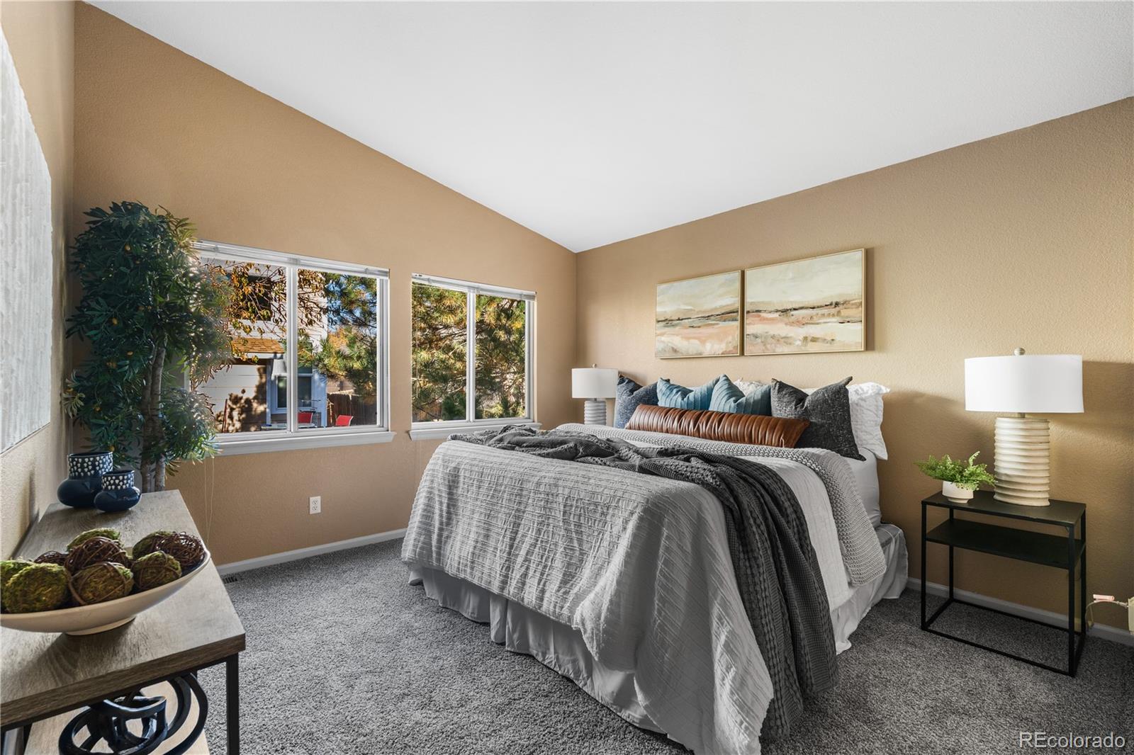 12799 East Wyoming Circle Aurora, CO 80012 - Photo 21 of 44 a bed room with a bed and a window