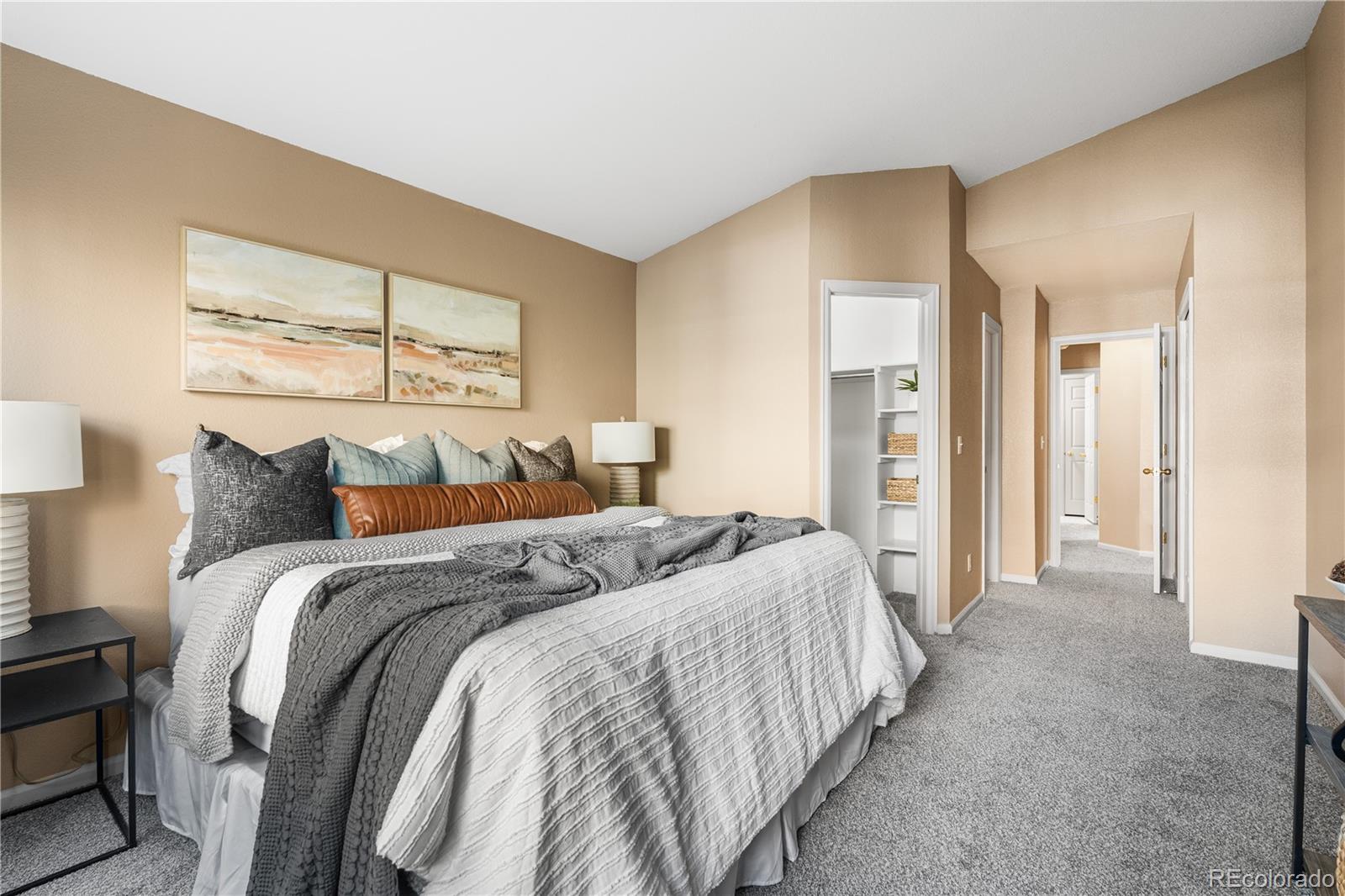 12799 East Wyoming Circle Aurora, CO 80012 - Photo 23 of 44 a bedroom with a bed and a window