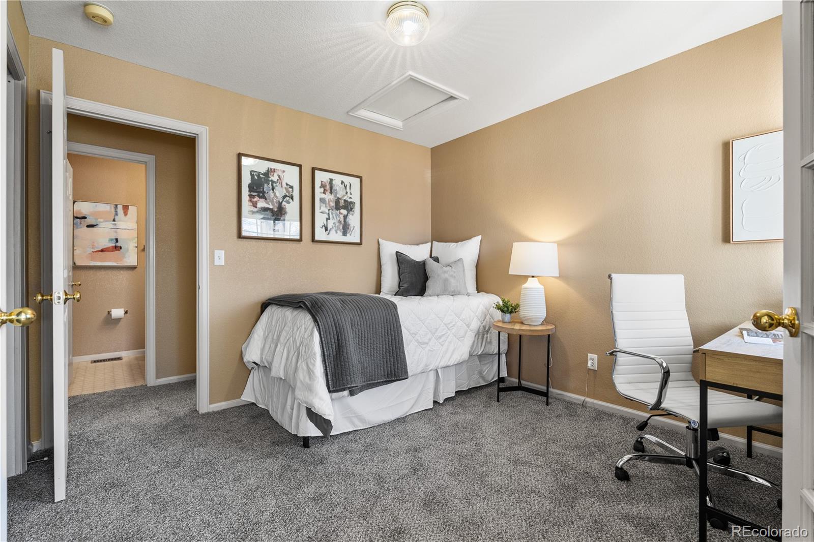 12799 East Wyoming Circle Aurora, CO 80012 - Photo 27 of 44 a bed room with a bed and a chair