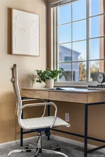 a dining room with furniture and window