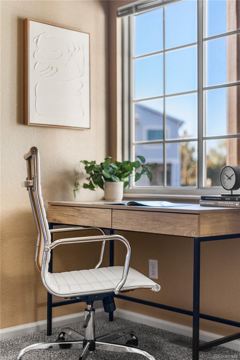 12799 East Wyoming Circle Aurora, CO 80012 - Photo 29 of 44 a dining room with furniture and window