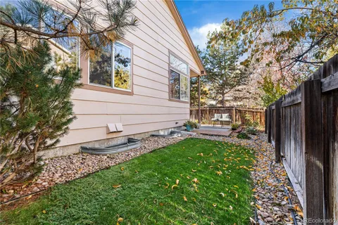 a view of a back yard with a house