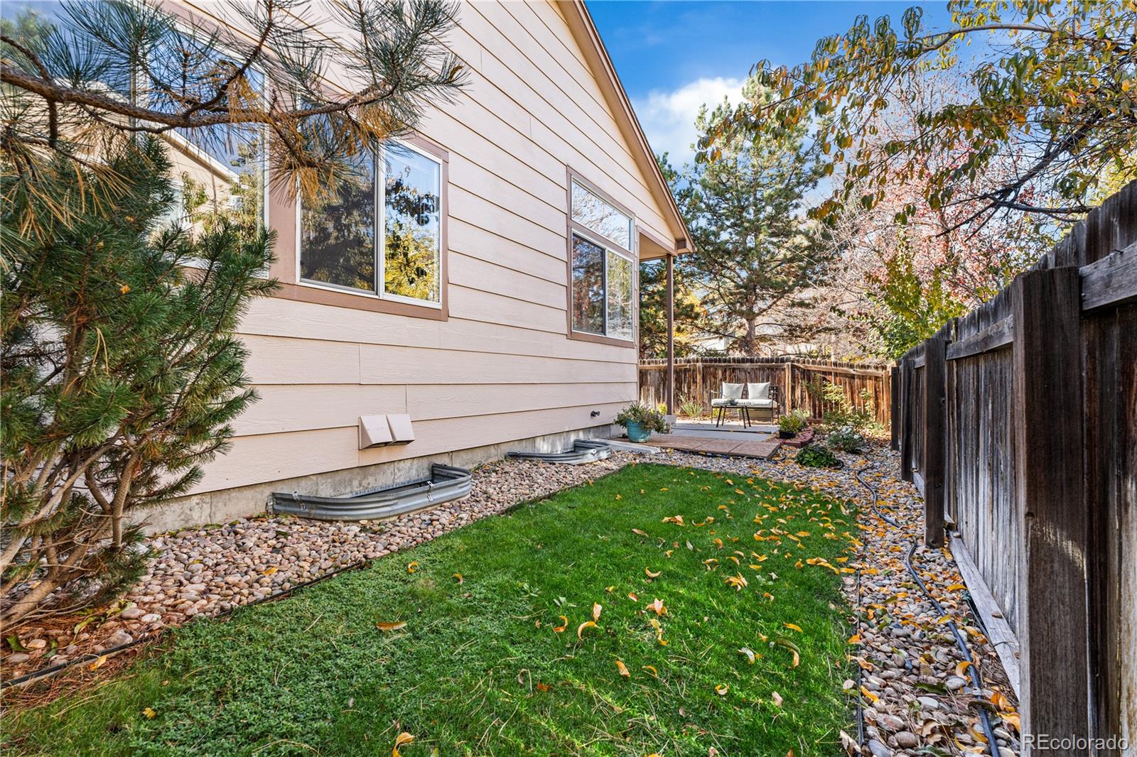 12799 East Wyoming Circle Aurora, CO 80012 - Photo 37 of 44 a view of a back yard with a house