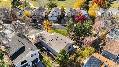 an aerial view of multiple houses with yard
