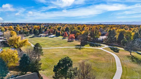 a view of a swimming pool with an outdoor seating and a yard