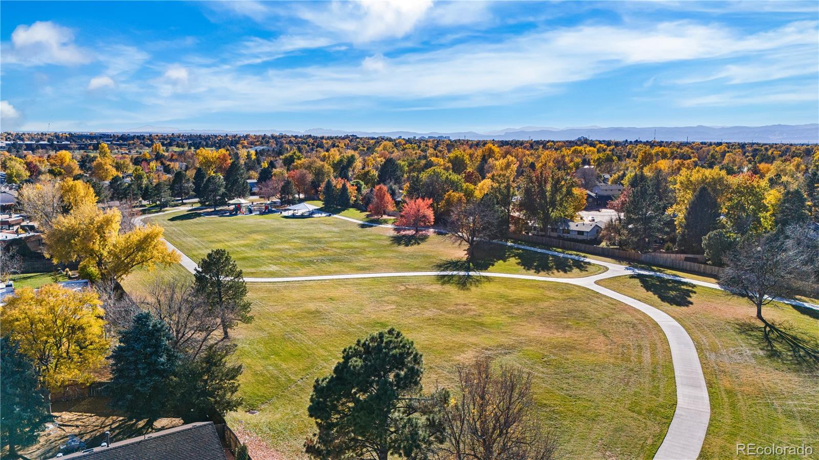 12799 East Wyoming Circle Aurora, CO 80012 - Photo 43 of 44 a view of a swimming pool with an outdoor seating and a yard