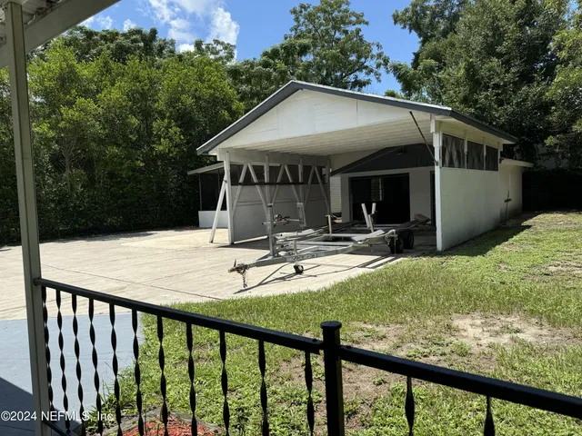 a view of house with backyard porch and furniture