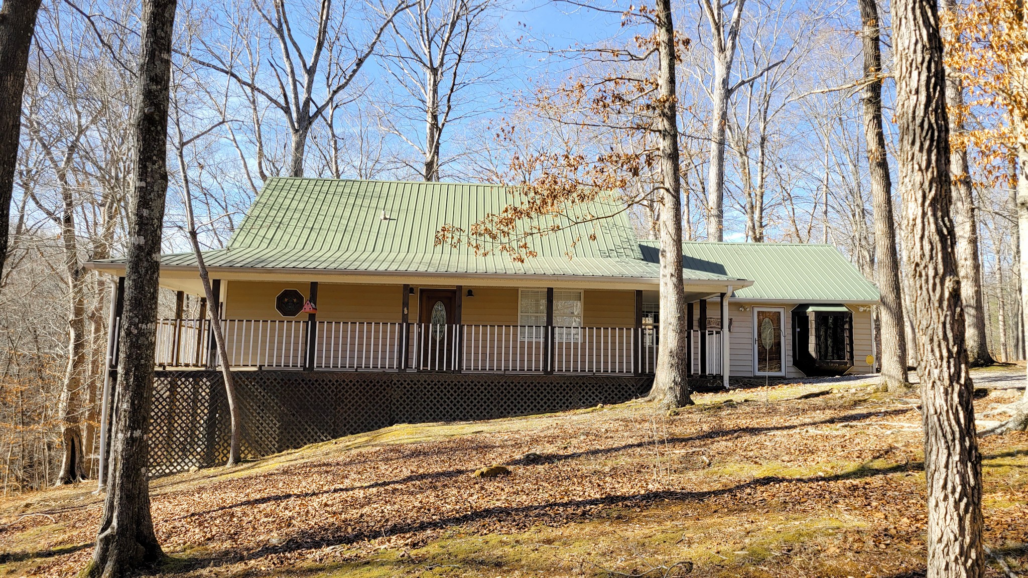 1678 4 Seasons Road Smithville, TN 37166 - Photo 14 of 43 a view of a house with snow on the wall