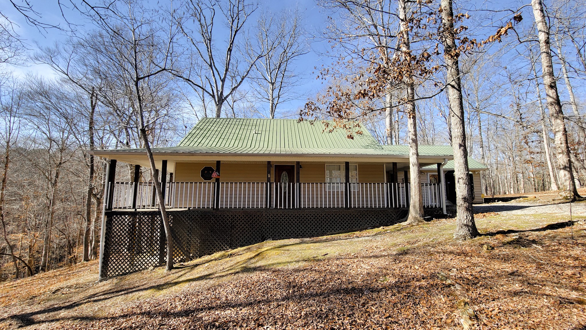 1678 4 Seasons Road Smithville, TN 37166 - Photo 15 of 43 a front view of a house with a yard
