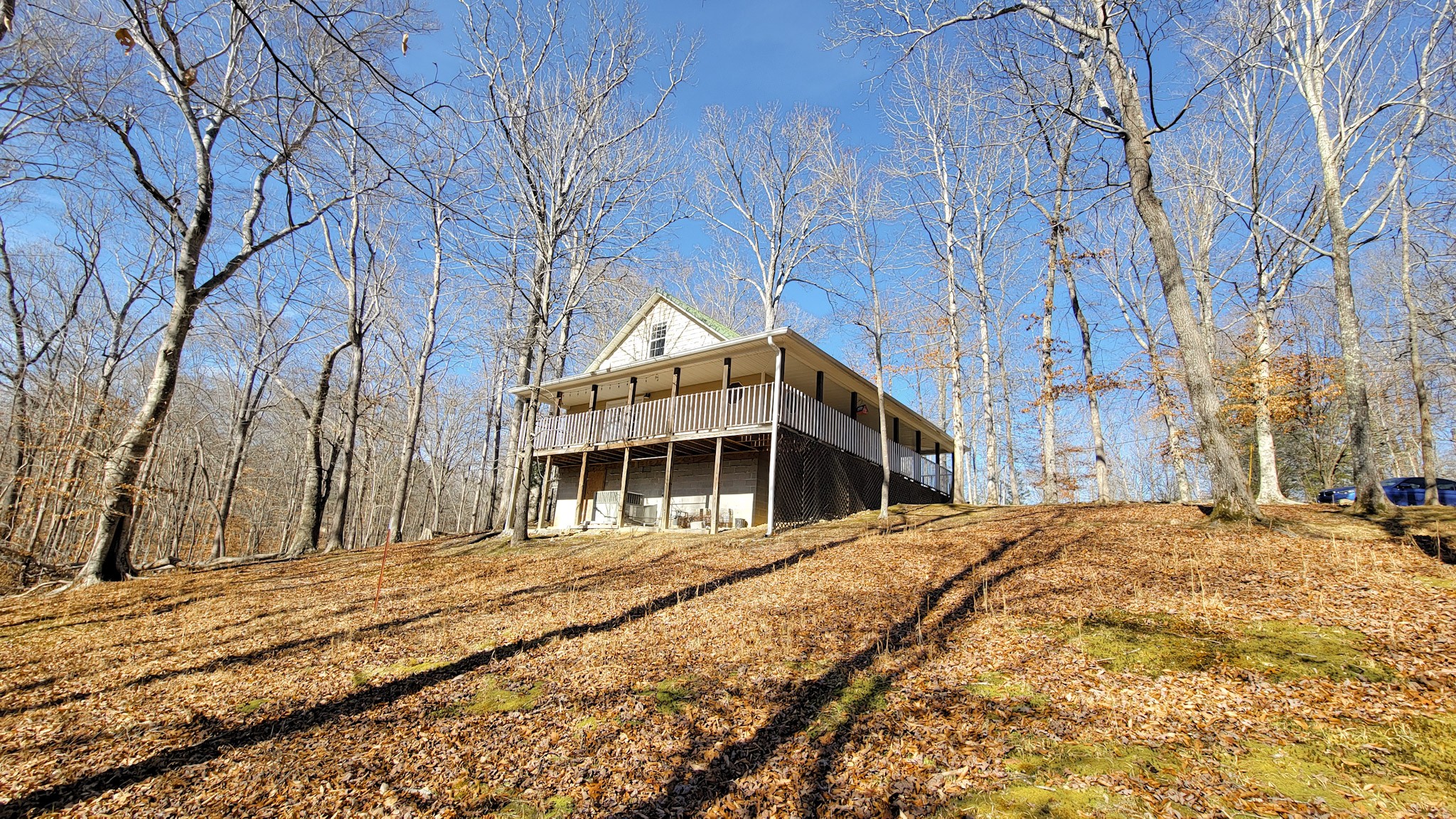 1678 4 Seasons Road Smithville, TN 37166 - Photo 16 of 43 a view of a house with a snow in the yard