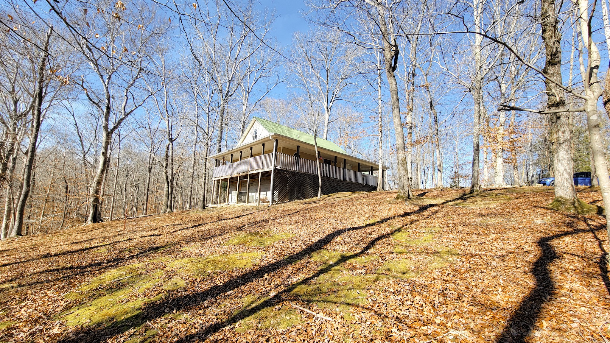 1678 4 Seasons Road Smithville, TN 37166 - Photo 17 of 43 a front view of a house with a yard