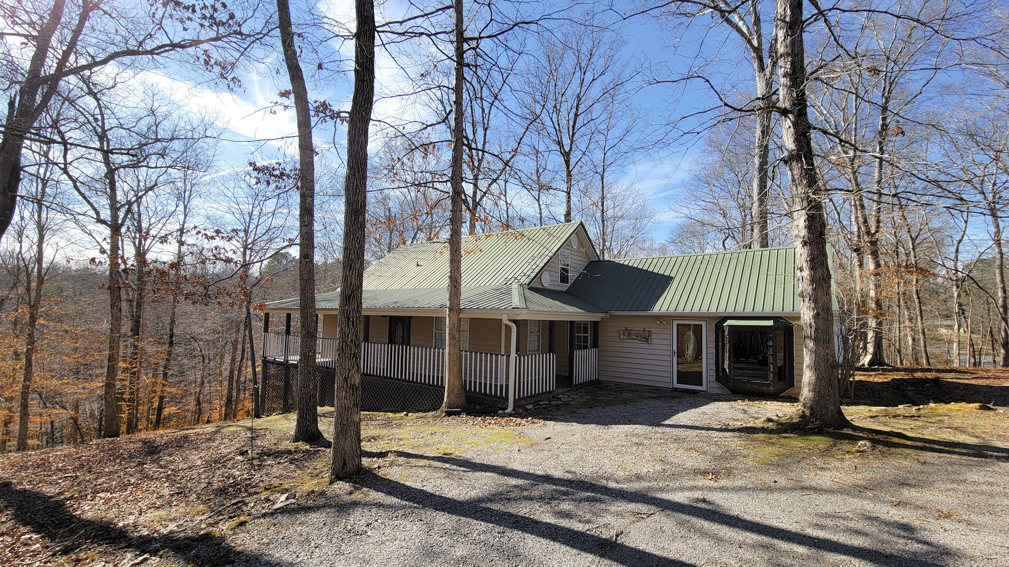1678 4 Seasons Road Smithville, TN 37166 - Photo 18 of 43 a view of a barn house next to a yard with wooden fence