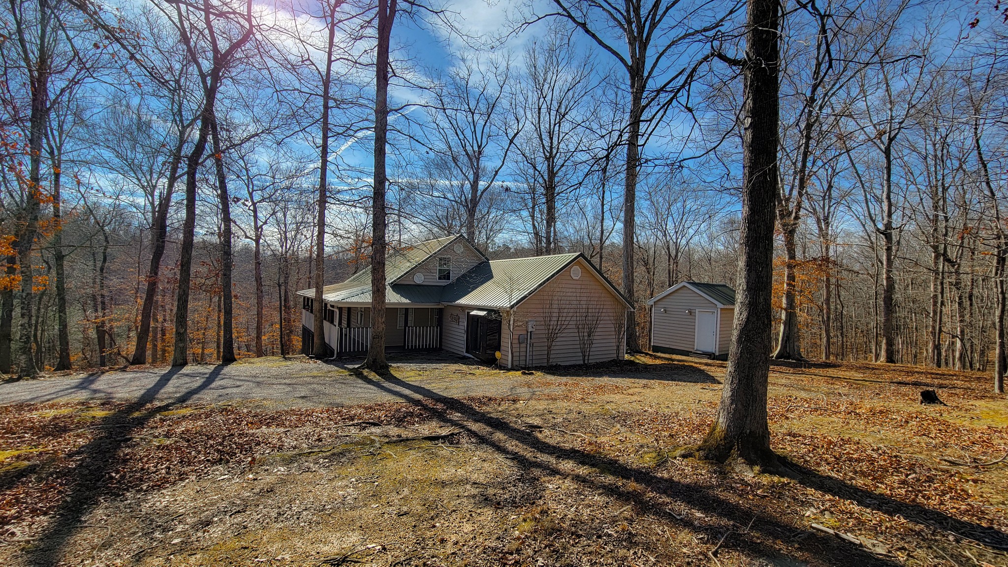 1678 4 Seasons Road Smithville, TN 37166 - Photo 20 of 43 a view of a house with snow on the road