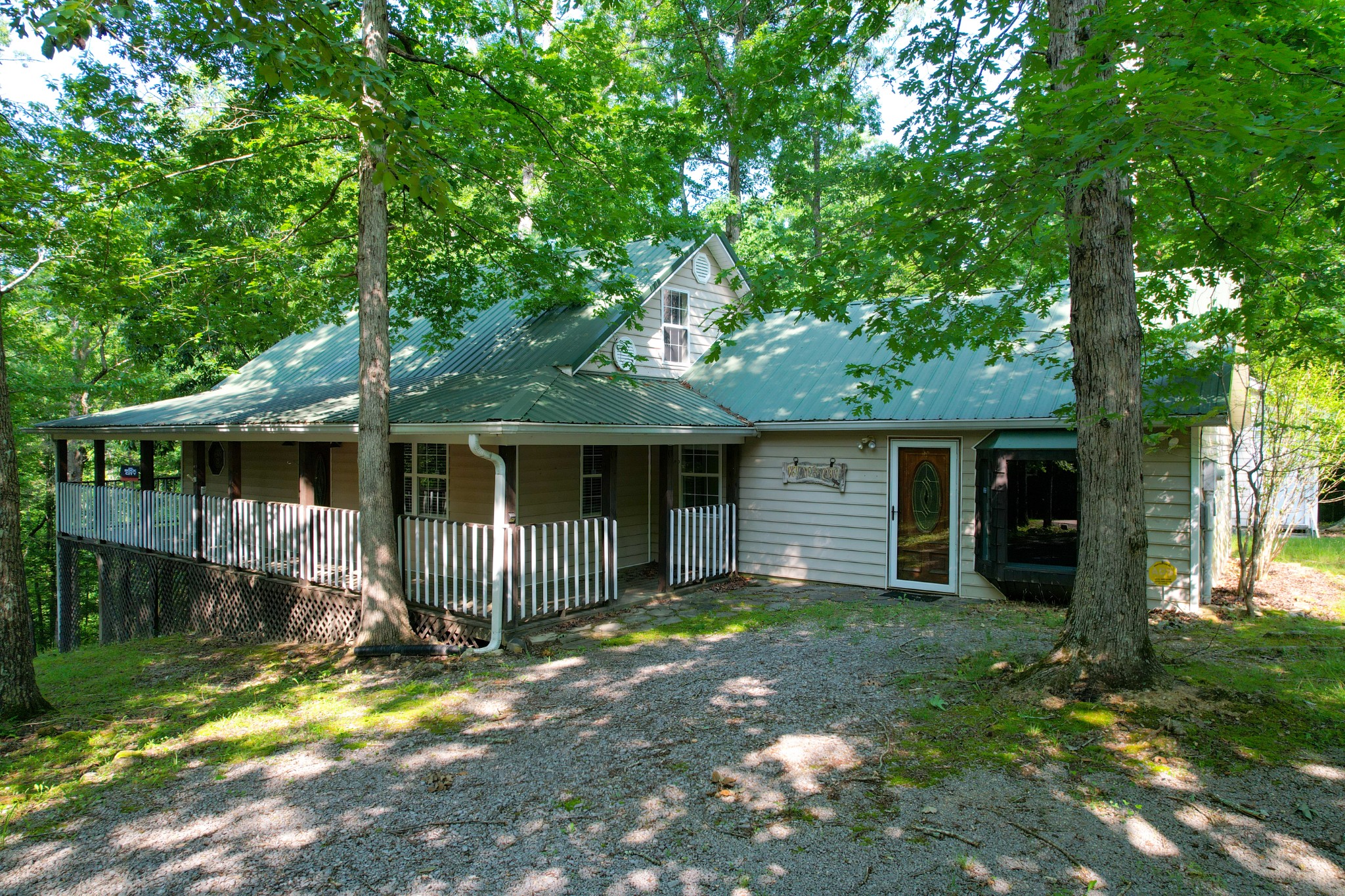 1678 4 Seasons Road Smithville, TN 37166 - Photo 2 of 43 a view of a house with backyard and a tree