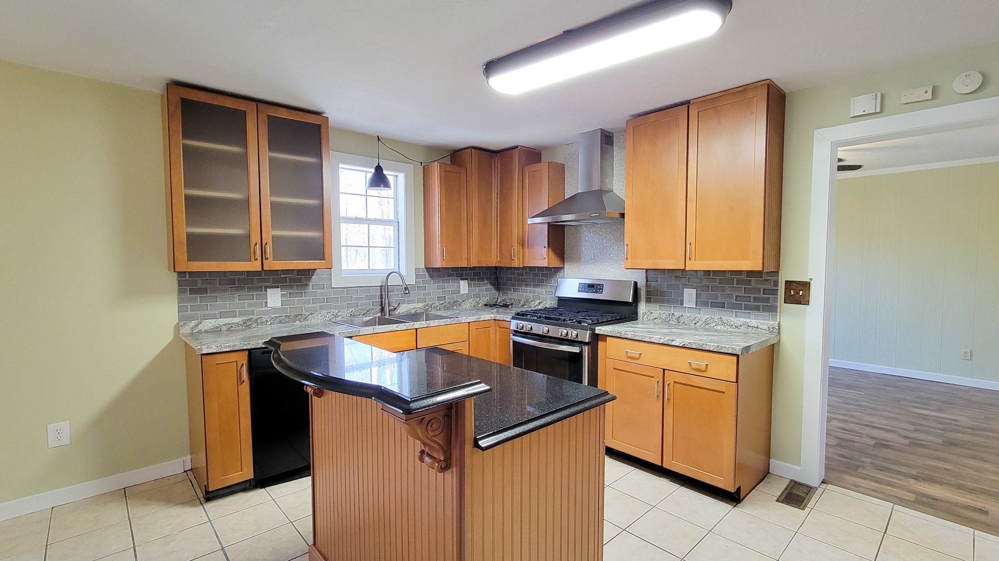 1678 4 Seasons Road Smithville, TN 37166 - Photo 27 of 43 a kitchen with granite countertop cabinets and window