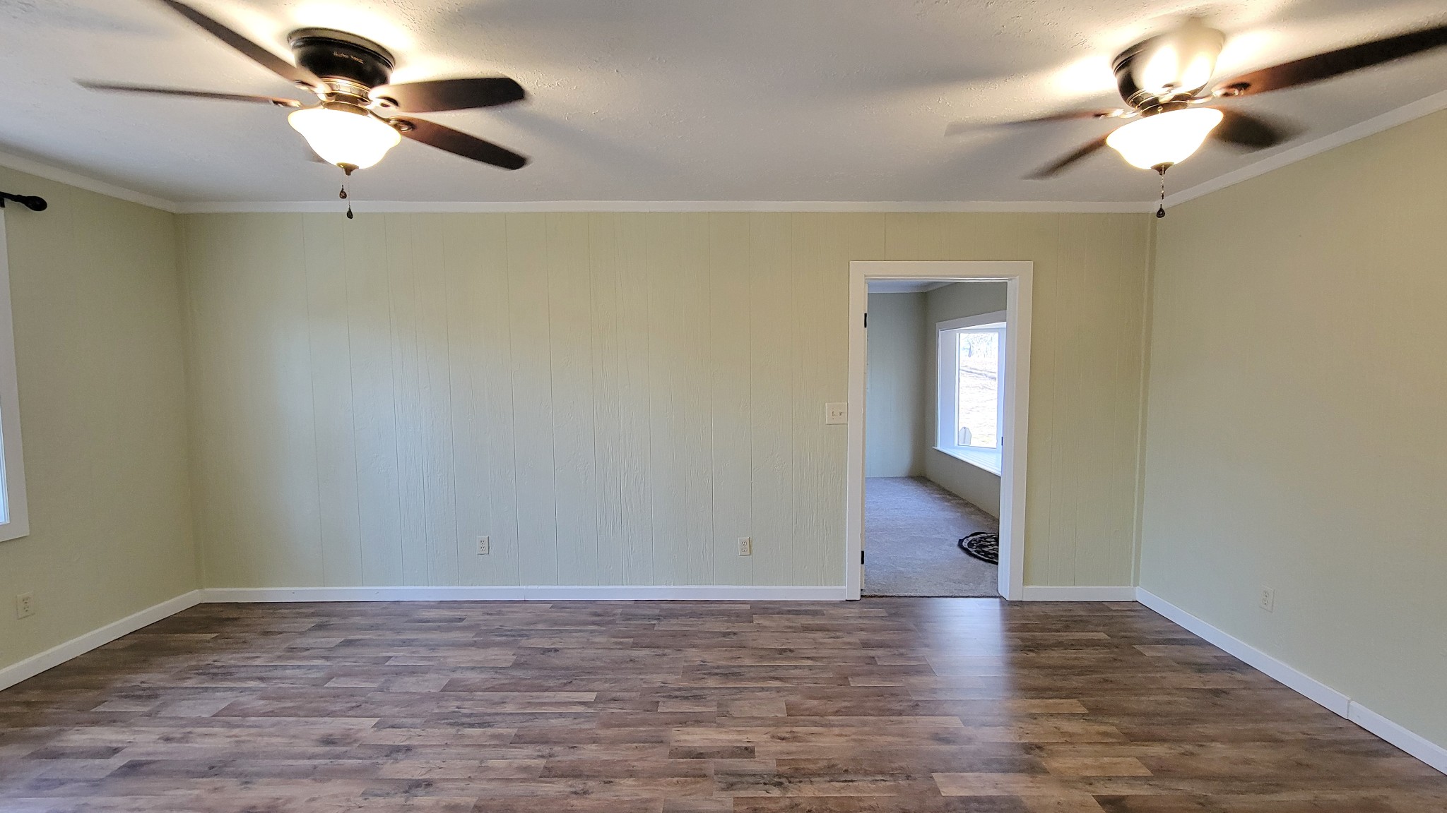 1678 4 Seasons Road Smithville, TN 37166 - Photo 28 of 43 a view of a room with wooden floor and a ceiling fan