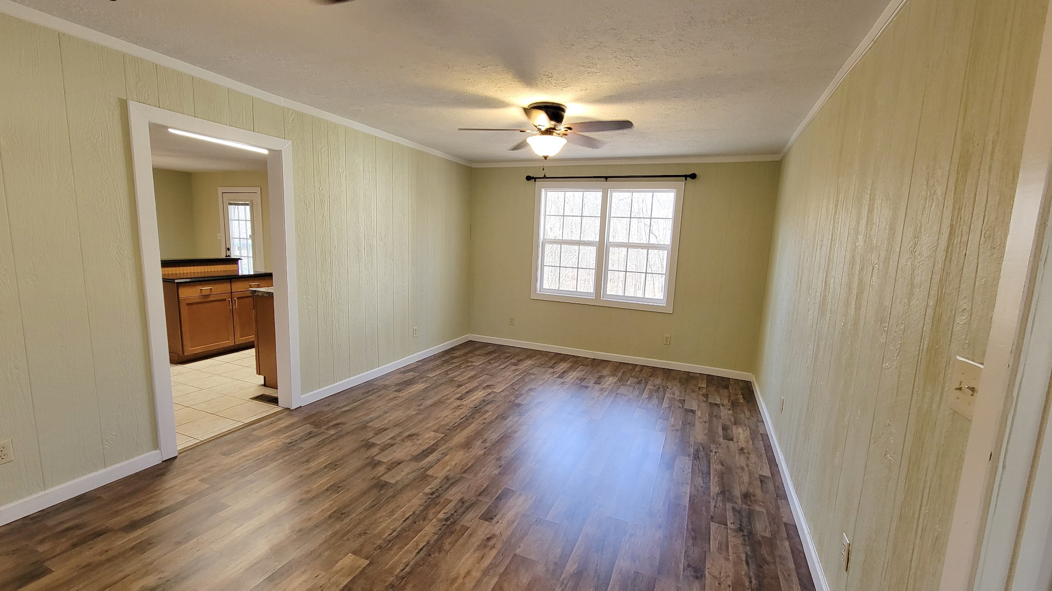 1678 4 Seasons Road Smithville, TN 37166 - Photo 29 of 43 wooden floor in an empty room with a window