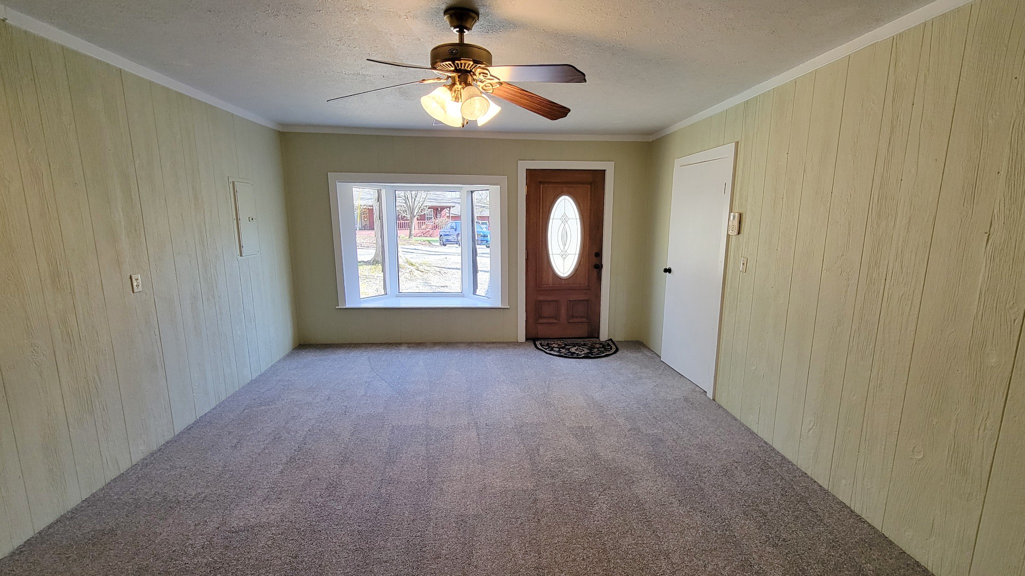 1678 4 Seasons Road Smithville, TN 37166 - Photo 30 of 43 an empty room with windows and fan