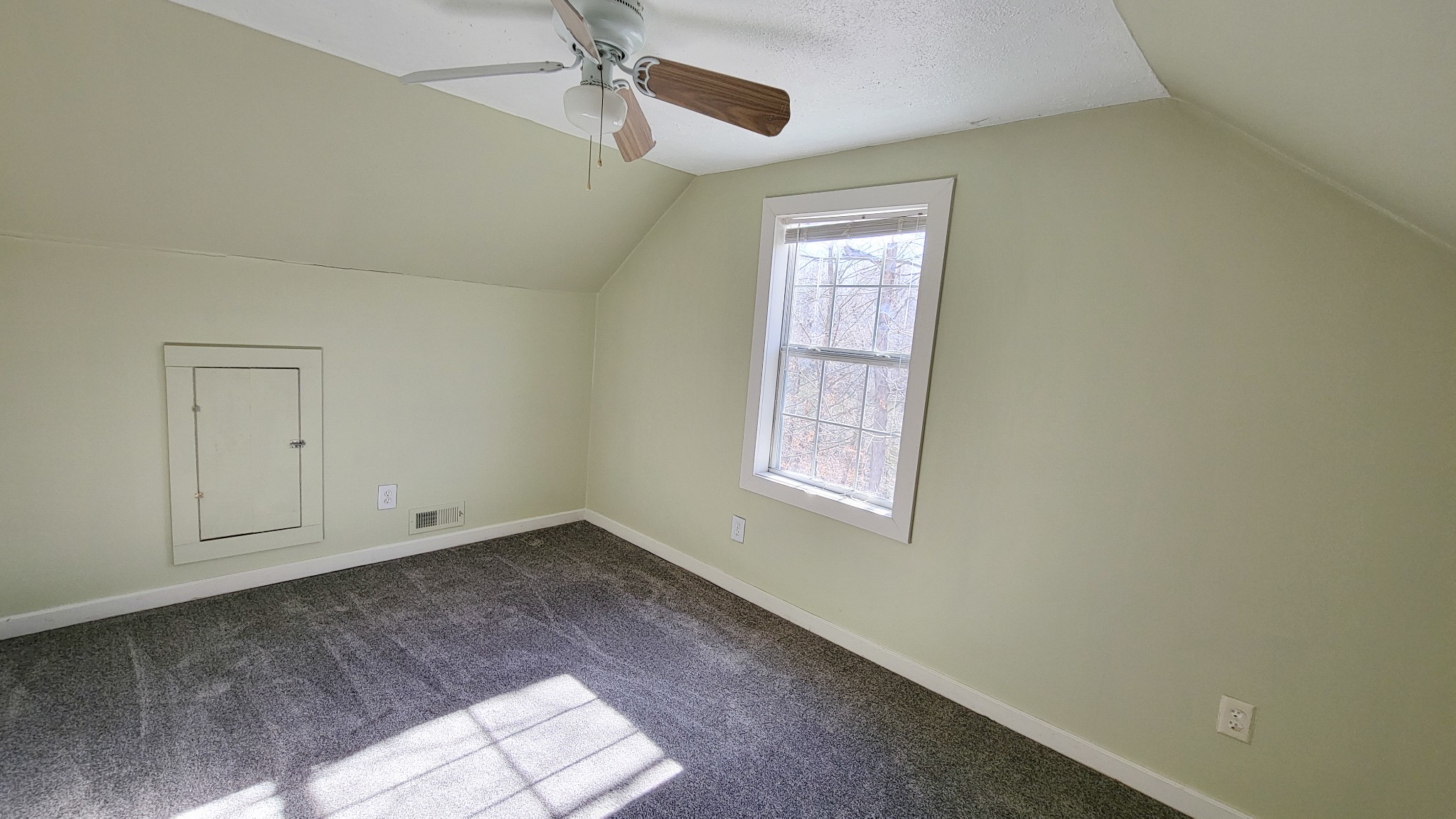 1678 4 Seasons Road Smithville, TN 37166 - Photo 37 of 43 an empty room with windows and fan