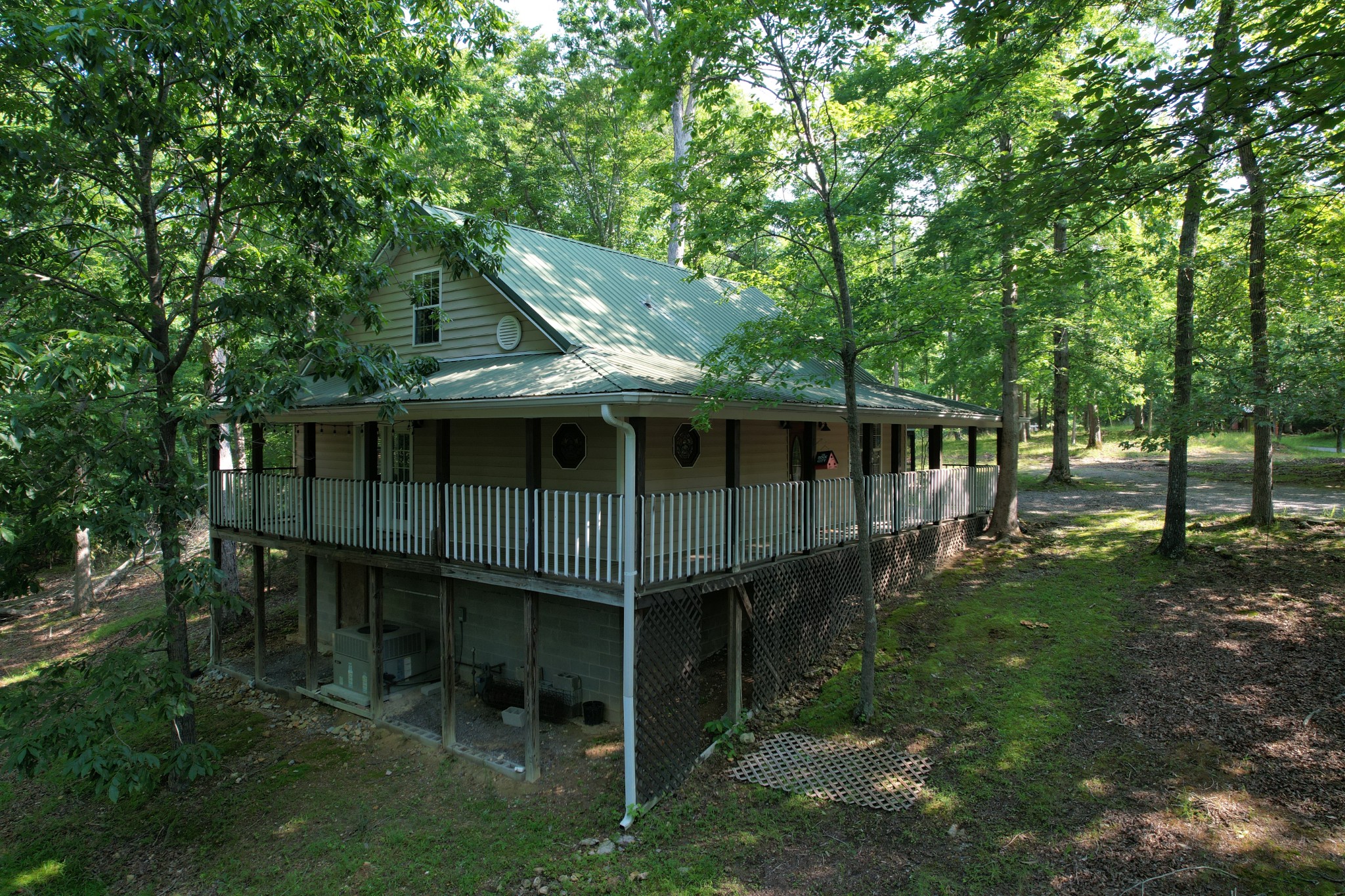 1678 4 Seasons Road Smithville, TN 37166 - Photo 4 of 43 a view of house with backyard space and garden