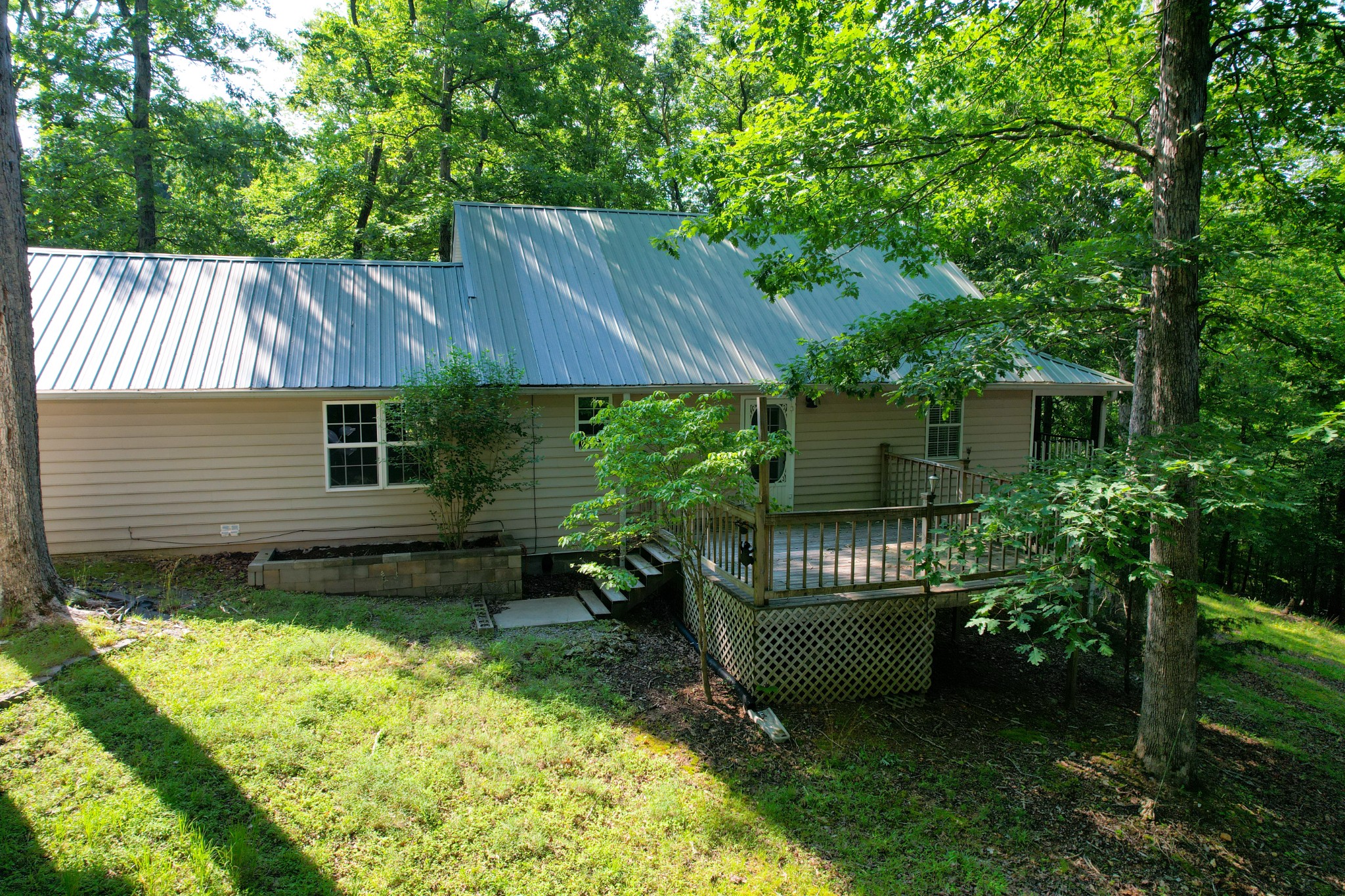 1678 4 Seasons Road Smithville, TN 37166 - Photo 5 of 43 a house view with a backyard space