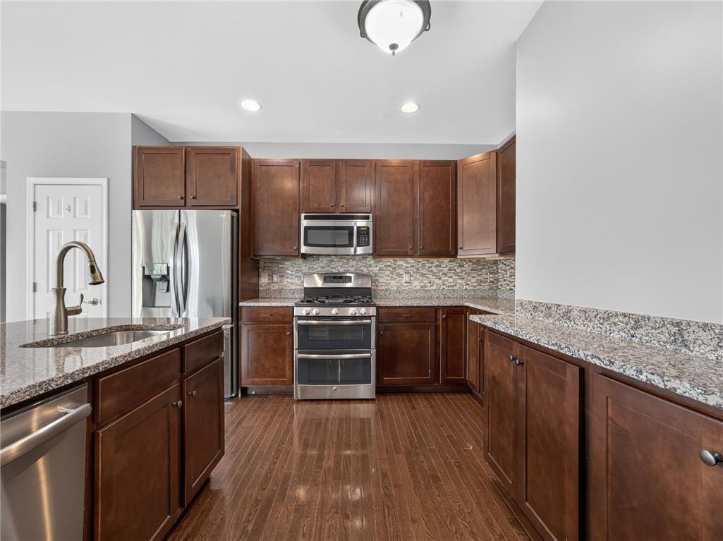 2765 Farmstead Road Easton, PA 18040 - Photo 23 of 50 A well-appointed kitchen showcasing rich cabinetry, granite countertops, and modern stainless steel appliances.