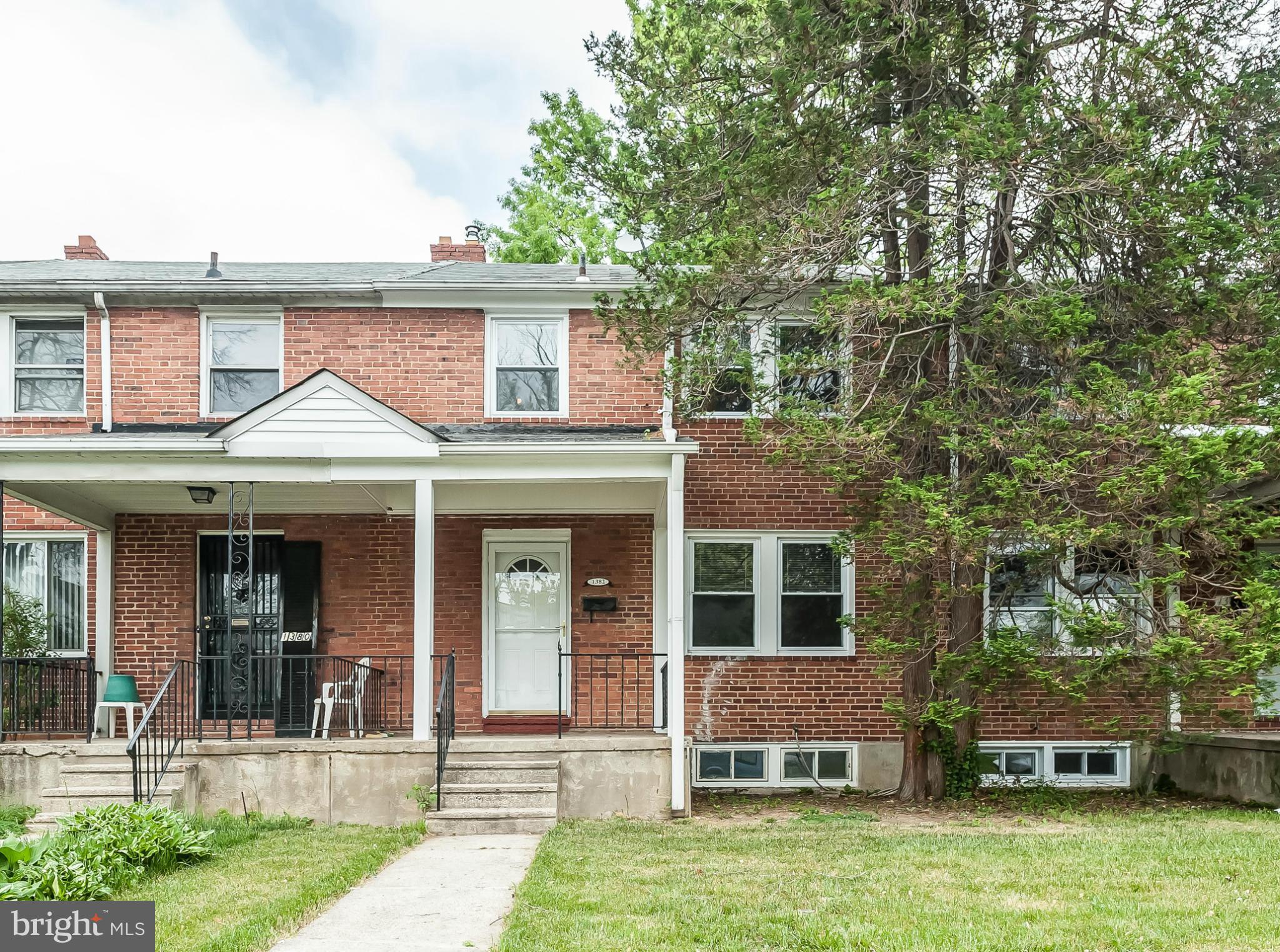 1382 Pentwood Road Baltimore, MD 21239 - Photo 3 of 30 front view of a house with a yard