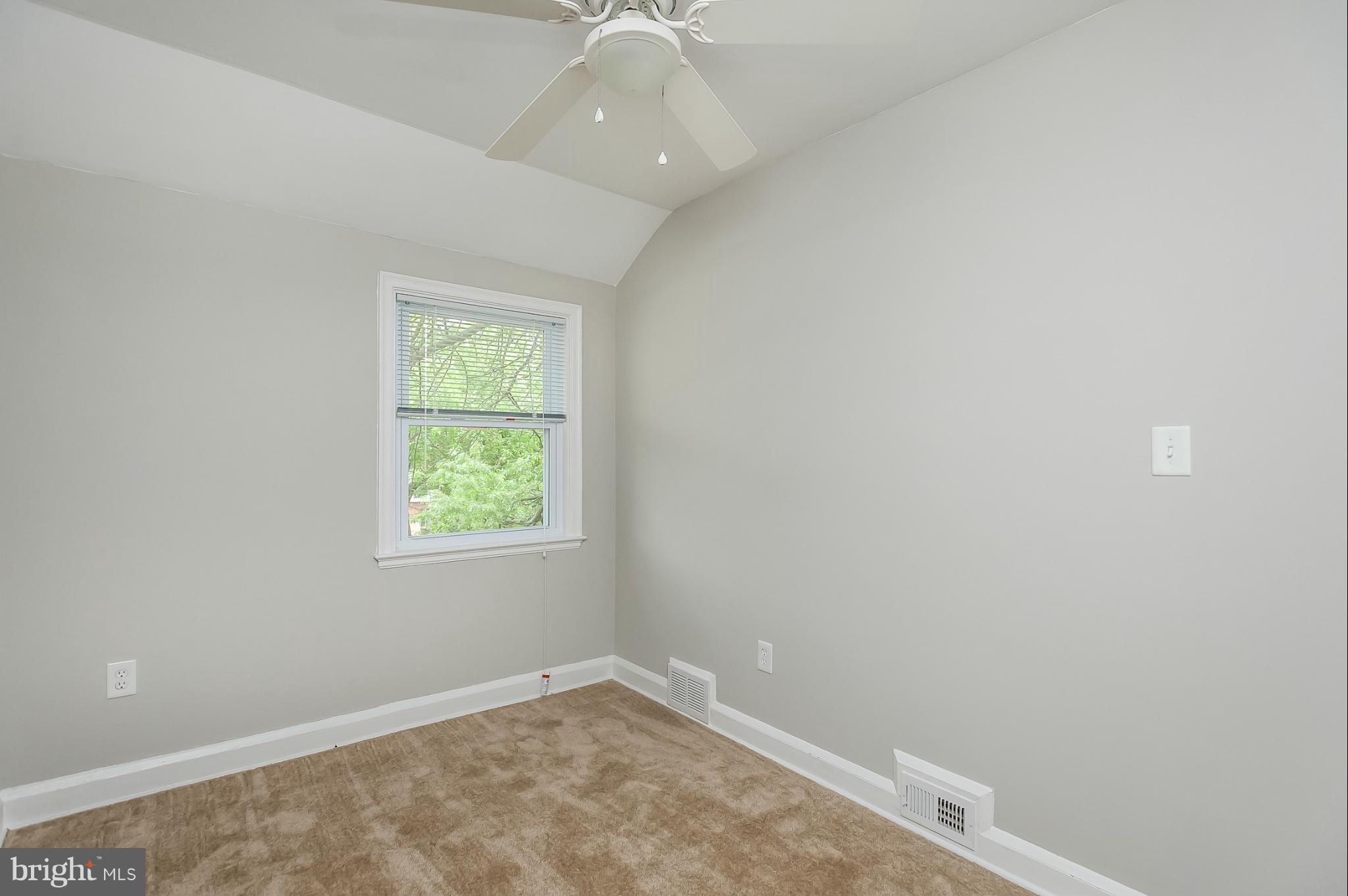 1382 Pentwood Road Baltimore, MD 21239 - Photo 22 of 30 an empty room with a window