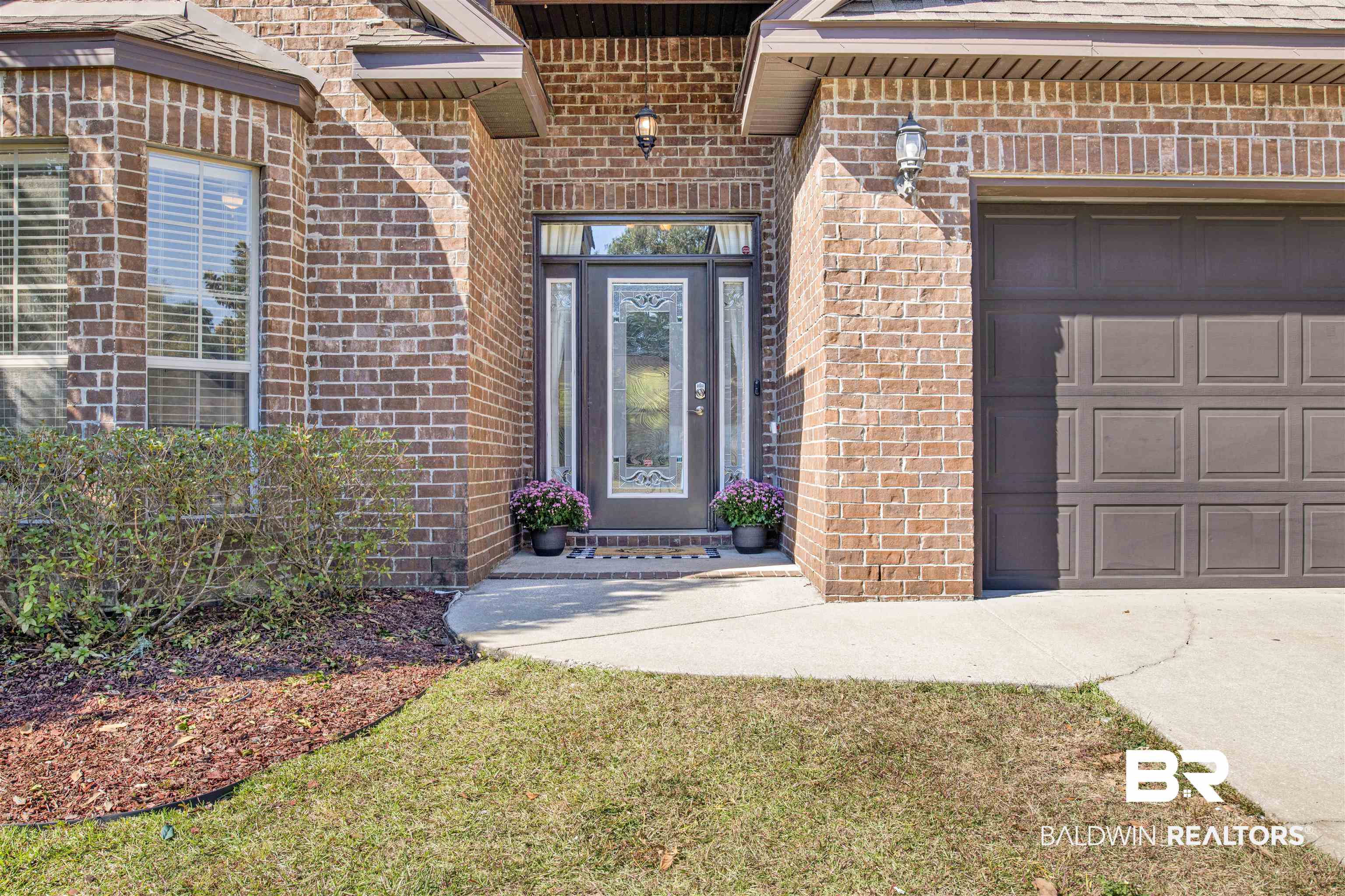 24159 Tullamore Drive Daphne, AL 36526 - Photo 4 of 31 Property entrance featuring a yard and a garage