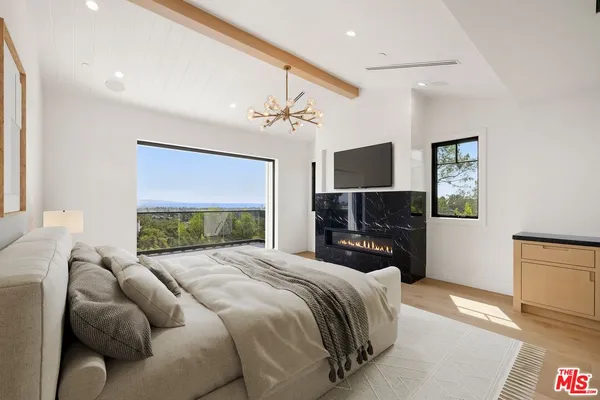 an aerial view of residential houses with city view