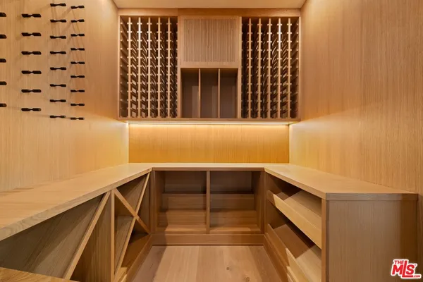 a spacious bathroom with a double vanity sink and a mirror