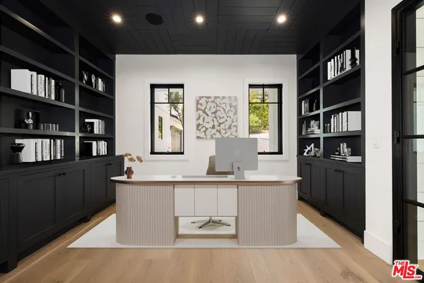 a living room with fireplace furniture and a flat screen tv