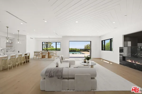 a house with swimming pool in front of it