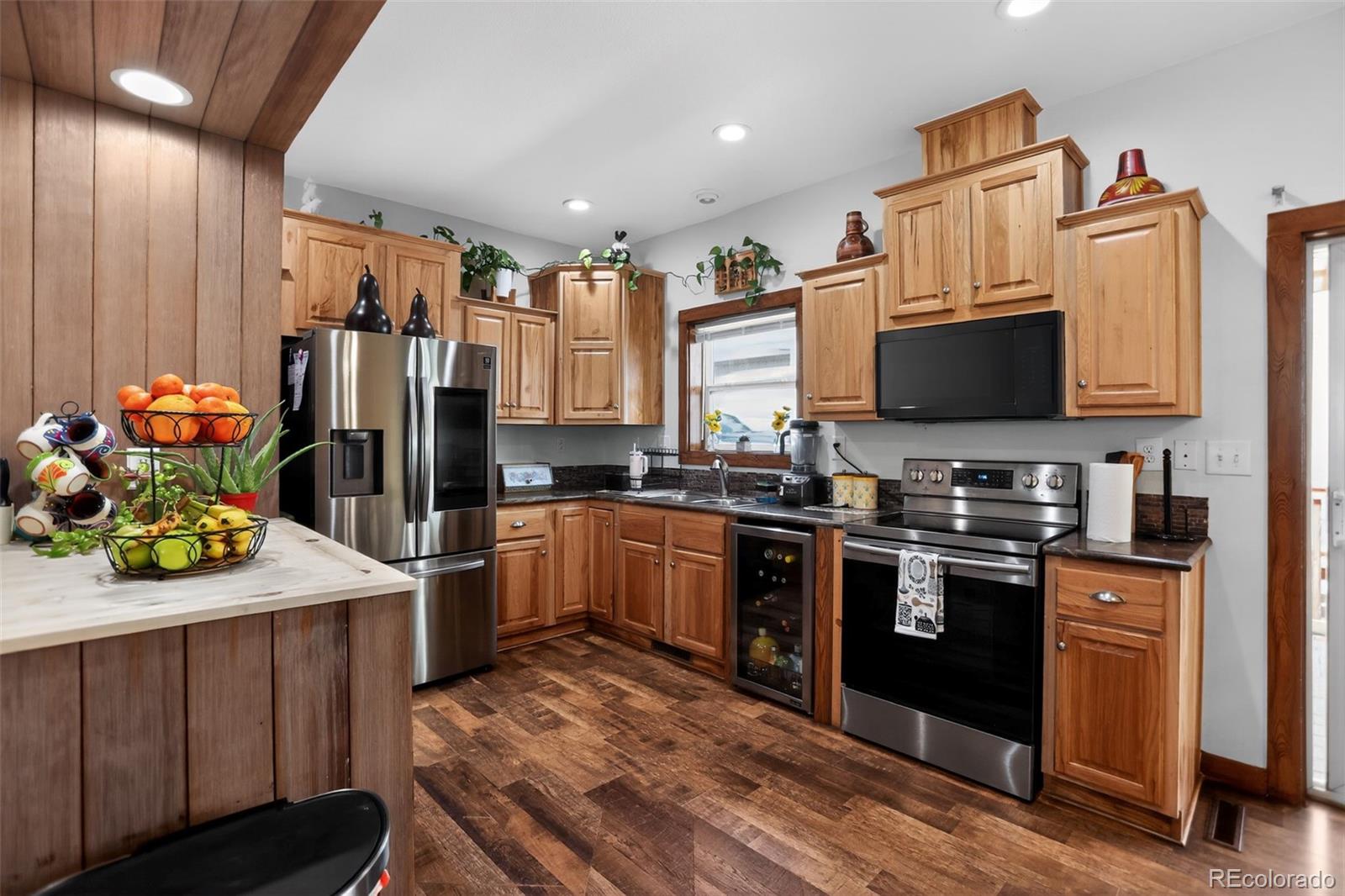 10 Salmon Loop Gypsum, CO 81637 - Photo 6 of 15 a kitchen with stainless steel appliances a stove refrigerator sink and cabinets