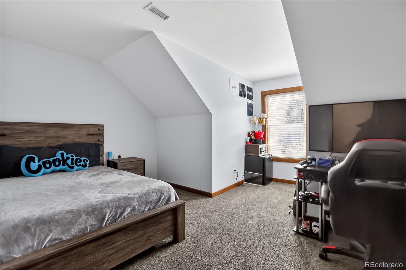 10 Salmon Loop Gypsum, CO 81637 - Photo 7 of 15 a bedroom with a bed a desk and a couch