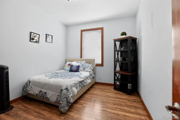 a bedroom with a bed and a table