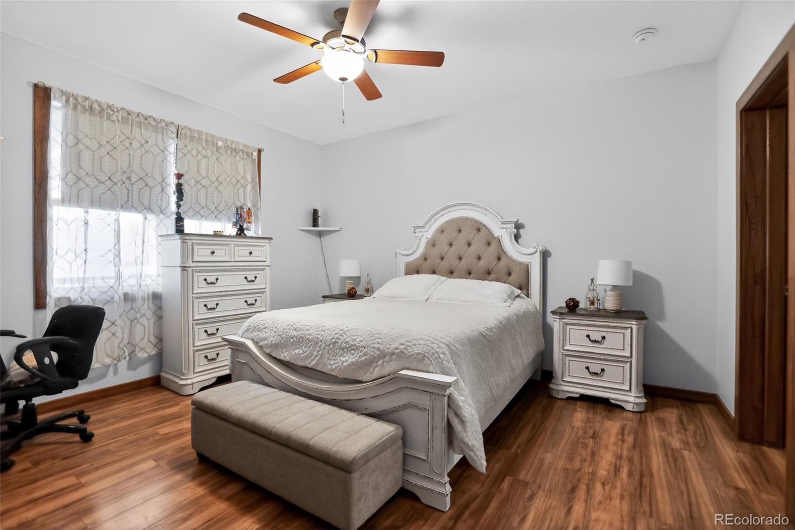 10 Salmon Loop Gypsum, CO 81637 - Photo 9 of 15 a bedroom with a bed and wooden floor