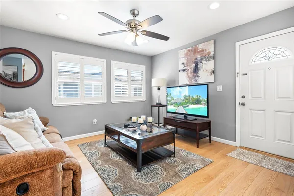 a living room with furniture and a flat screen tv