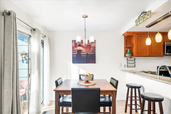 a dining room with furniture and window