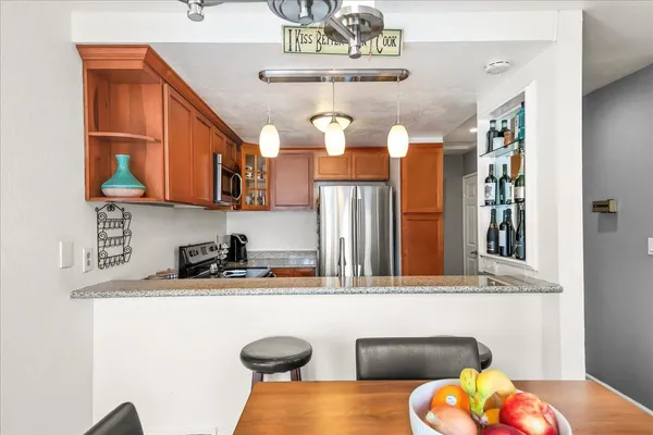 a kitchen with a sink and a stove