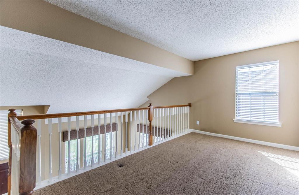 4117 Oxlea Drive Plano, TX 75024 - Photo 11 of 17 a view of a hallway with windows