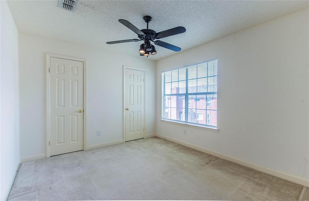 4117 Oxlea Drive Plano, TX 75024 - Photo 12 of 17 an empty room with window and ceiling fan