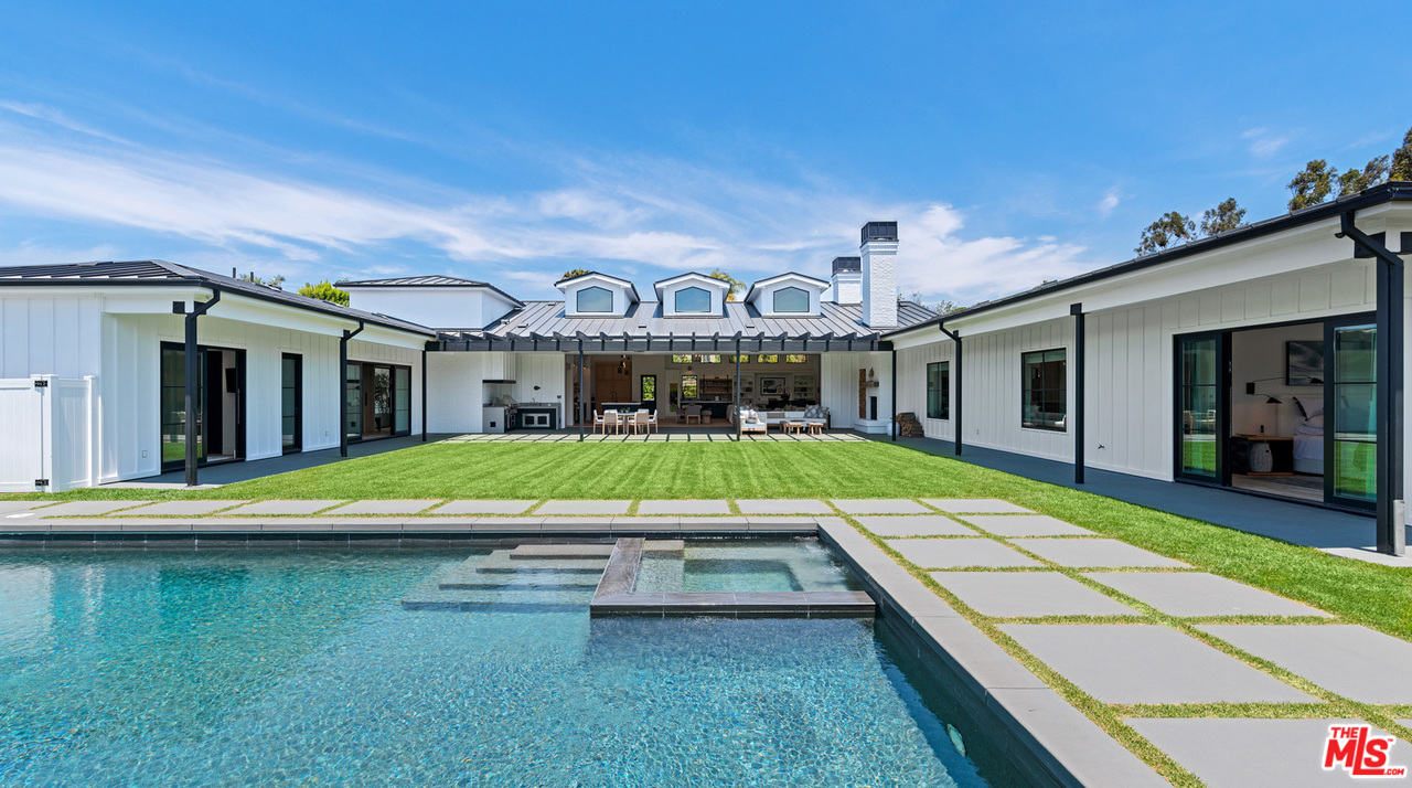 6530 Zuma View Place Malibu, CA 90265 - Photo 23 of 31 a view of an house with swimming pool and porch