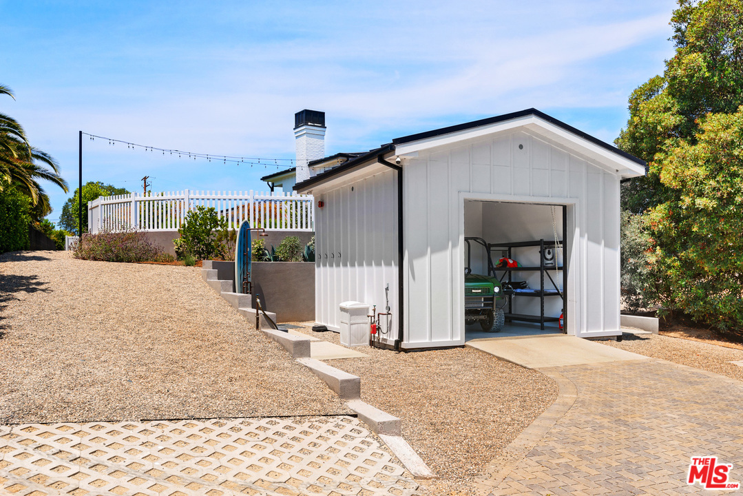 6530 Zuma View Place Malibu, CA 90265 - Photo 25 of 31 a view of a house with a backyard