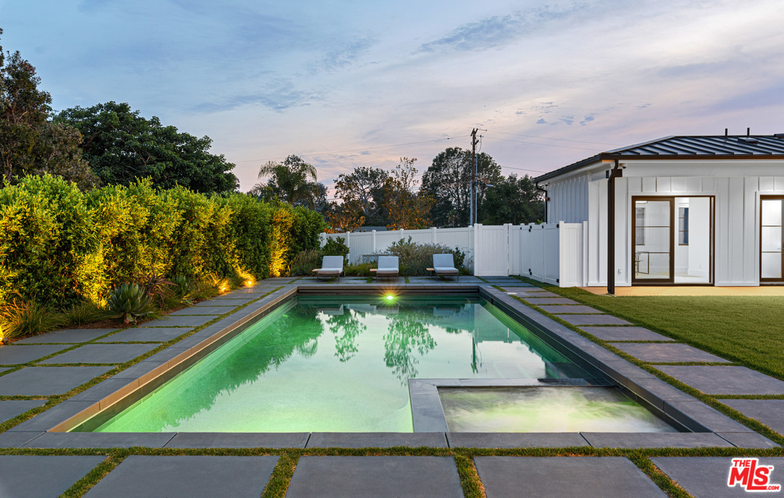 6530 Zuma View Place Malibu, CA 90265 - Photo 30 of 31 a view of a swimming pool with a yard