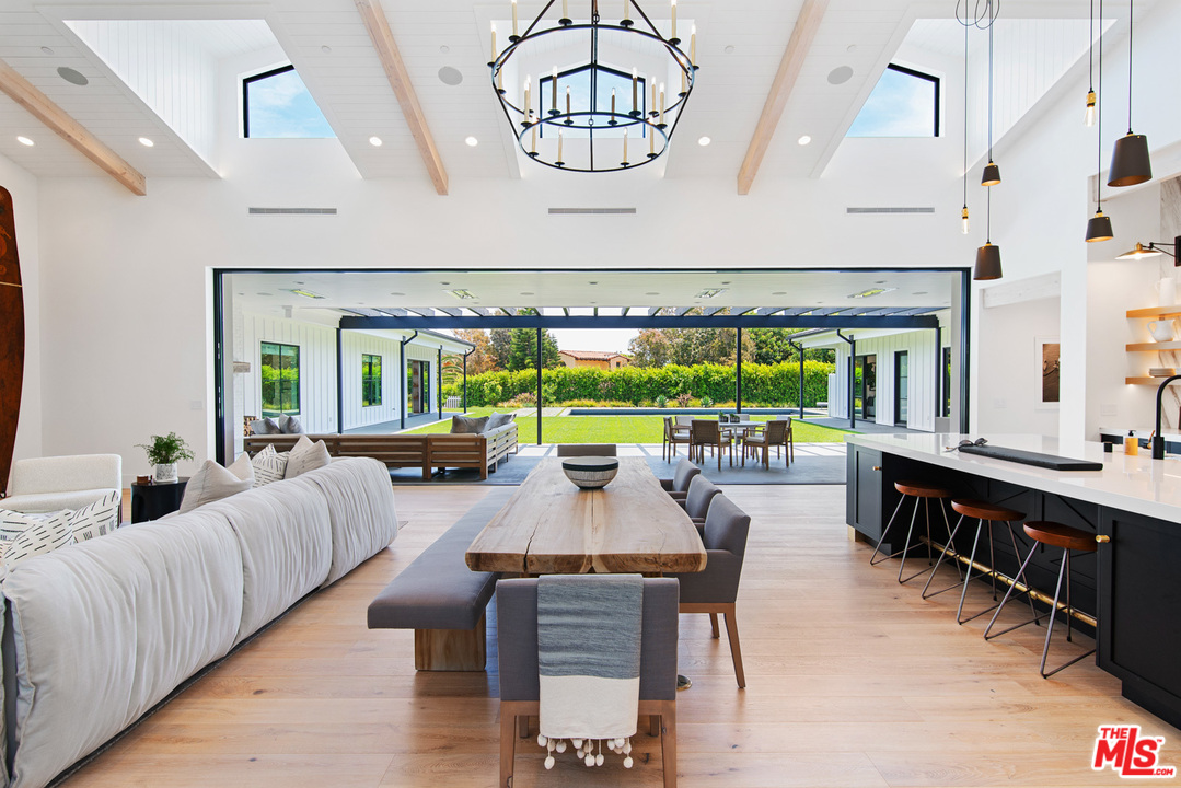 6530 Zuma View Place Malibu, CA 90265 - Photo 4 of 31 a living room with furniture and a large window