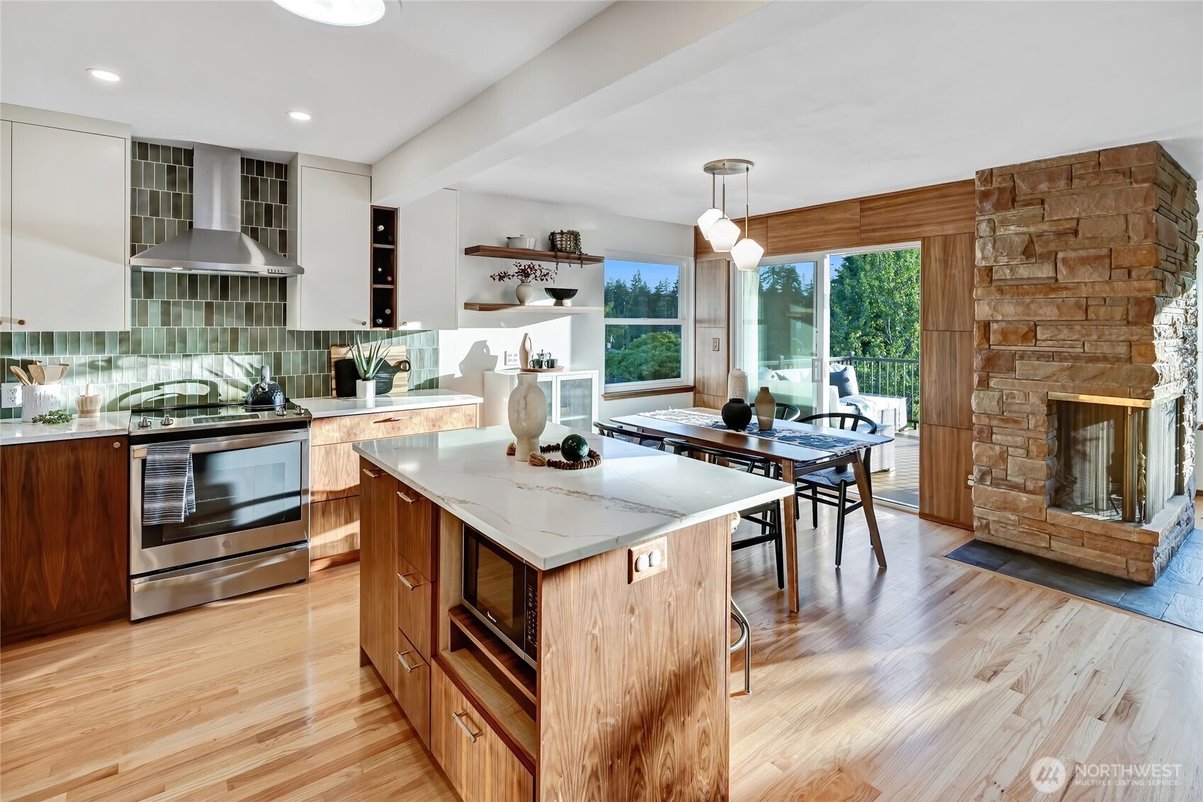 7571 45th Avenue Southwest Seattle, WA 98136 - Photo 12 of 40 a kitchen with a stove and a refrigerator