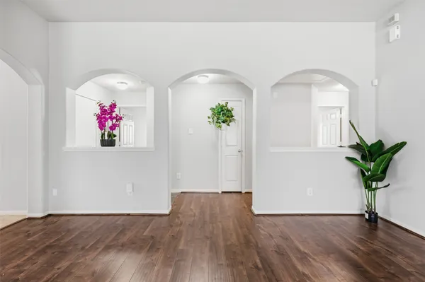 a view of front door with wooden floor