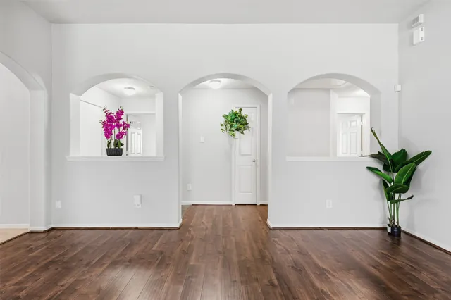 a view of front door with wooden floor