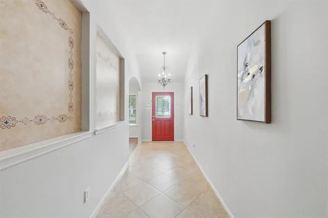 a view of a hallway with windows